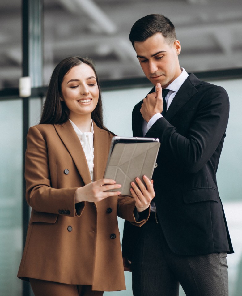 male-and-female-business-people-working-on-tablet-in-office.jpg